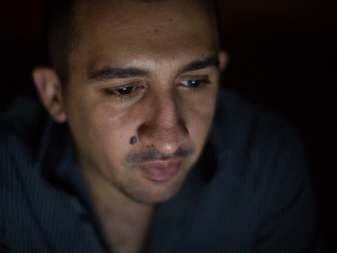 Tariq Abu Khumra talks with his mother on Skype. So far, none of his relatives have secured visas to move to the U.S.