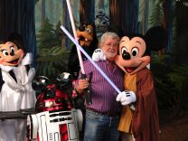 In this handout image provided by Disney, "Star Wars" creator and filmmaker George Lucas meets a group of "Star Wars"-inspired Disney characters Aug. 14, 2010 at Disney's Hollywood Studios theme park in Lake Buena Vista, Fla.  Lucas is in central Florida for "Star Wars Celebration V," the official Lucasfilm fan event that is taking place this week at the Orange County Convention Center in Orlando, Fla. 