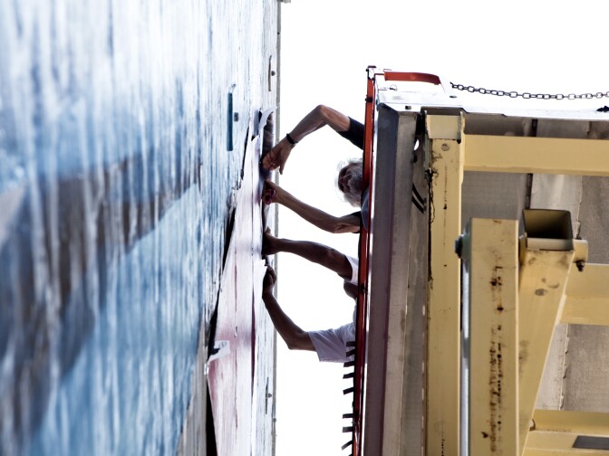 Hanging the Kent Twitchell mural of Rafer Johnson and Loretta Claiborne to honor the 2015 Special Olympics in L.A. 