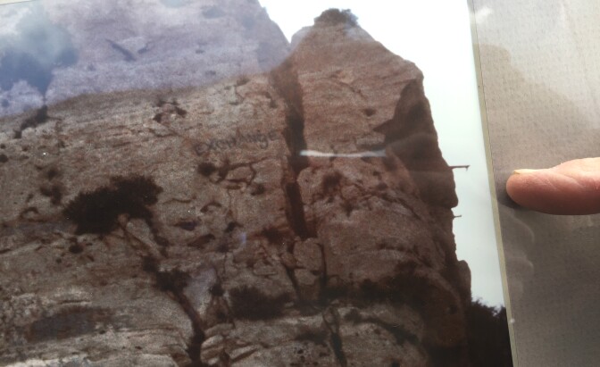 Stephen Seemayer points to scaffolding his mother, Lynne Westmore Bloom, used to climb the cliff above the Malibu Canyon tunnel and paint the 60-foot nude Pink Lady in 1966.