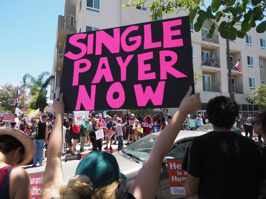 People rally in favor of single-payer healthcare for all Californians as the US Senate prepares to vote on the Senate GOP health care bill, outside the office of California Assembly Speaker Anthony Rendon, June 27, 2017 in South Gate, California.  
Rendon announced last week that Senate Bill SB 562 - the high-profile effort to establish a single-payer healthcare system in California - would be shelved, saying it was "incomplete."    / AFP PHOTO / Robyn Beck        (Photo credit should read ROBYN BECK/AFP/Getty Images)
