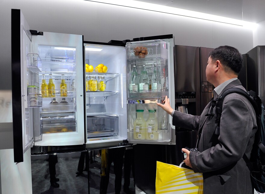 LAS VEGAS, NV - JANUARY 06:  An attendee looks over the LG Double Door-in-Door refrigerator at the 2015 International CES at the Las Vegas Convention Center on January 6, 2015 in Las Vegas, Nevada. CES, the world's largest annual consumer technology trade show, runs through January 9 and is expected to feature 3,600 exhibitors showing off their latest products and services to about 150,000 attendees.  (Photo by David Becker/Getty Images)