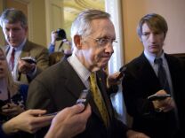 Senate Majority Leader Harry Reid, D-Nev., walks to a closed-door meeting with fellow Democrats at the Capitol on Sunday.