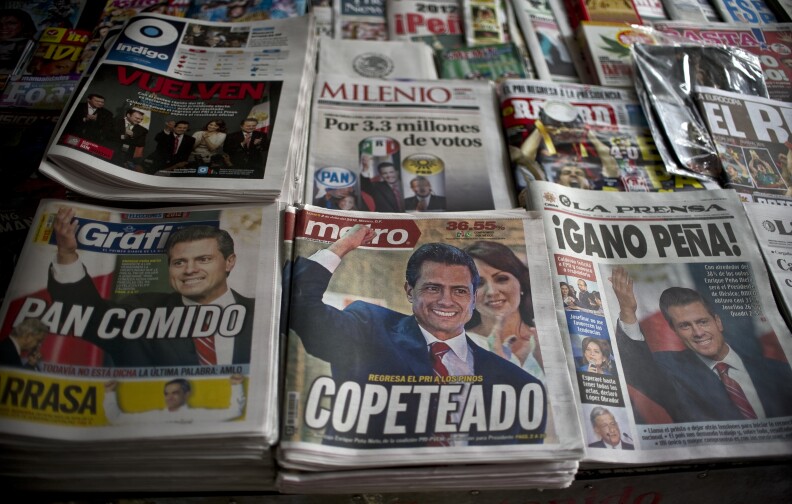Front pages of newspapers with information on the new Mexican president for the Institutional Revolutionary Party (PRI), Enrique Pena Nieto, on July 2, 2012. Pena Nieto, the youthful candidate of the party that governed Mexico for decades, claimed victory late on July 1 in the country's presidential election.
