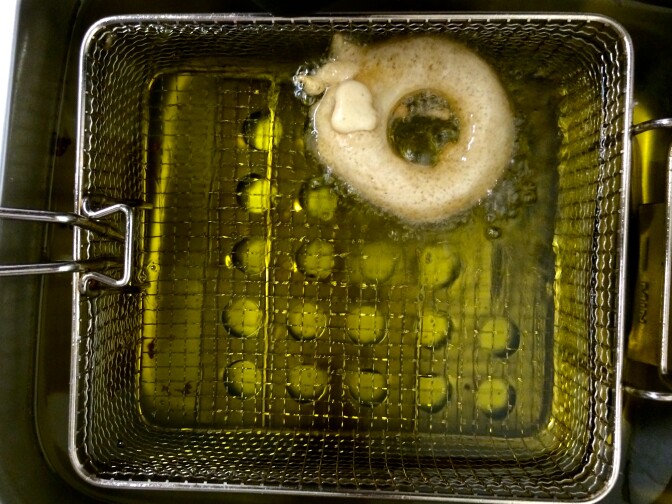 A sweet maui onion ring battered and fried in a rice flour, Guinness tempura batter.