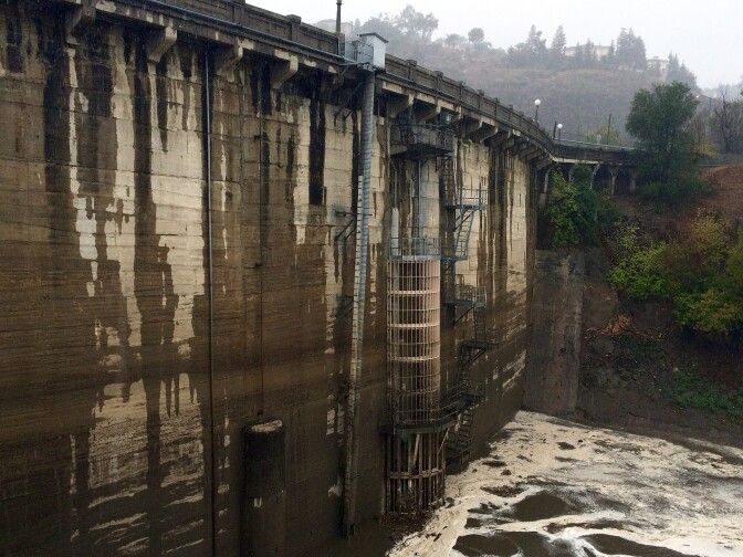 Water flows at Devil's Gate Dam in Pasadena on Tuesday morning, Sept. 15, 2015. Rainfall reached record levels in areas of Los Angeles. The scenario under which some 500 homes and parcels could flood is rare, but it is urgent enough that the county commissioned a report mapping the homes that could be flooded.