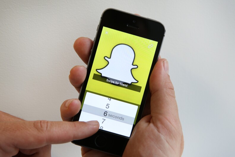 In this photo illustration the Snapchat app is used on an iPhone,