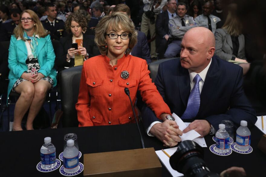 Retired NASA astronaut and Navy Capt. Mark Kelly (R) and his wife, shooting victim and former U.S. Rep. Gabby Giffords (D-AZ) prepares to give an opening statement before the Senate Judiciary Committee during hearing about gun control on Capitol Hill January 30, 2013 in Washington, DC. Giffords delivered an opening statment to the committee, which met for the first time since the mass shooting at a Sandy Hook Elementary School in Newtown, Connecticut.   