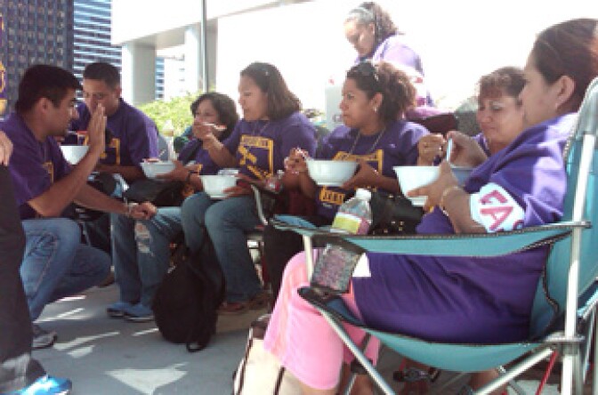 Janitors eat their last meal on Tuesday, Aug. 24, 2010 before fasting for three days outside the Century City JP Morgan. Members of the Service Employee Union are calling on JP Morgan Chase to give janitors their jobs back.