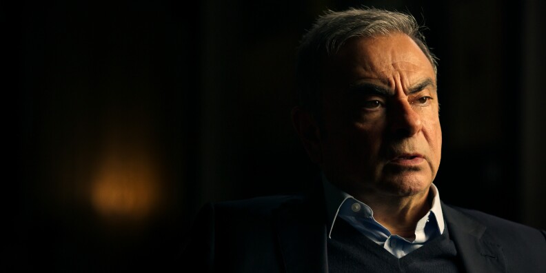 Man looks away from a camera.