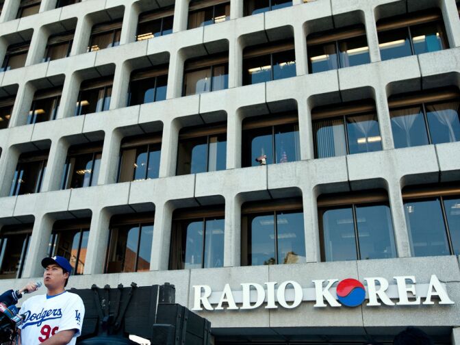 Hyun-Jin Ryu, 25, is interviewed in Korean before signing autographs for fans.