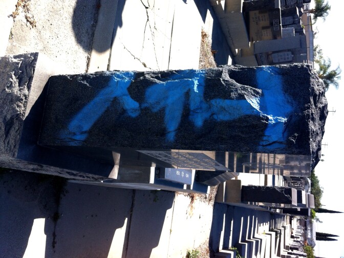 Mt Zion cemetery, East LA. Way to keep it classy, L'il Smokey. You've desecrated a grave. 