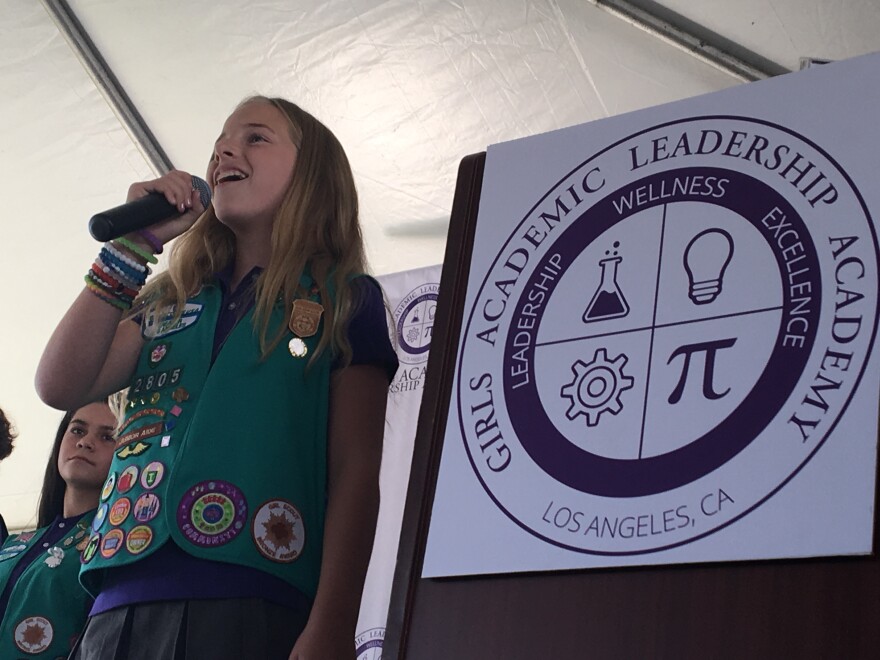 A student from the first class of Girls Academic Leadership Academy (GALA), the first non-charter single-sex school for traditional public school students to open in California in 20 years, sings the national anthem during a ribbon-cutting ceremony on Friday, Aug. 12.