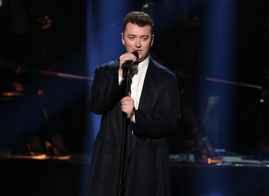 FILE - In this Nov. 23, 2014, file photo, Sam Smith performs on stage at the 42nd annual American Music Awards at Nokia Theatre L.A. Live in Los Angeles. Will the Grammys be “Drunk In Love” with Beyonce or will they fall for the sad, but soulful sound of Sam Smith? The Recording Academy will announce the nominees for the 57th annual Grammy Awards on Friday, Dec. 5, 2014. (Photo by Matt Sayles/Invision/AP, File)