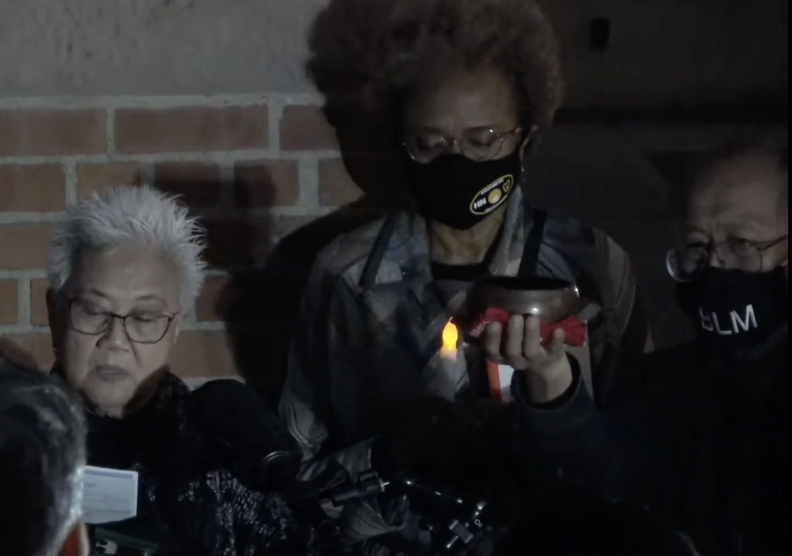 Three people -- two women and a man -- lead a ceremony commemorating the victims of the 1871 Chinese Massacre.