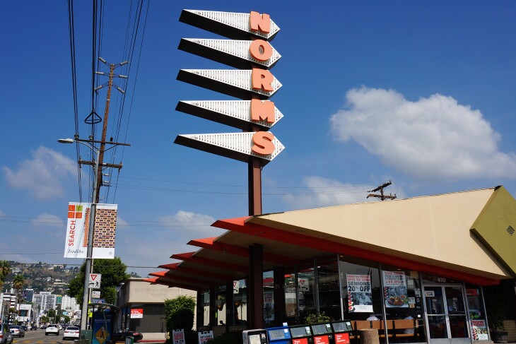 The distinction NORMS sign has each letter on a diamond shaped background