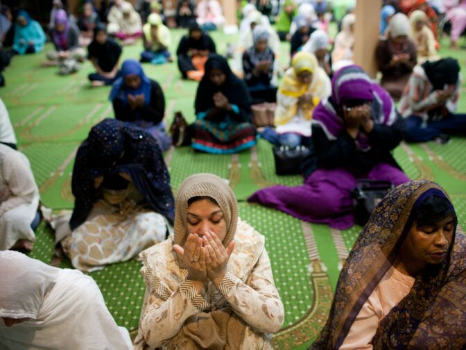 Women pray at the Islamic Center after listening to a talk by Dr. Maher Hathout. He called upon Muslims to refrain from provocations that are not in harmony with the values of Islam.