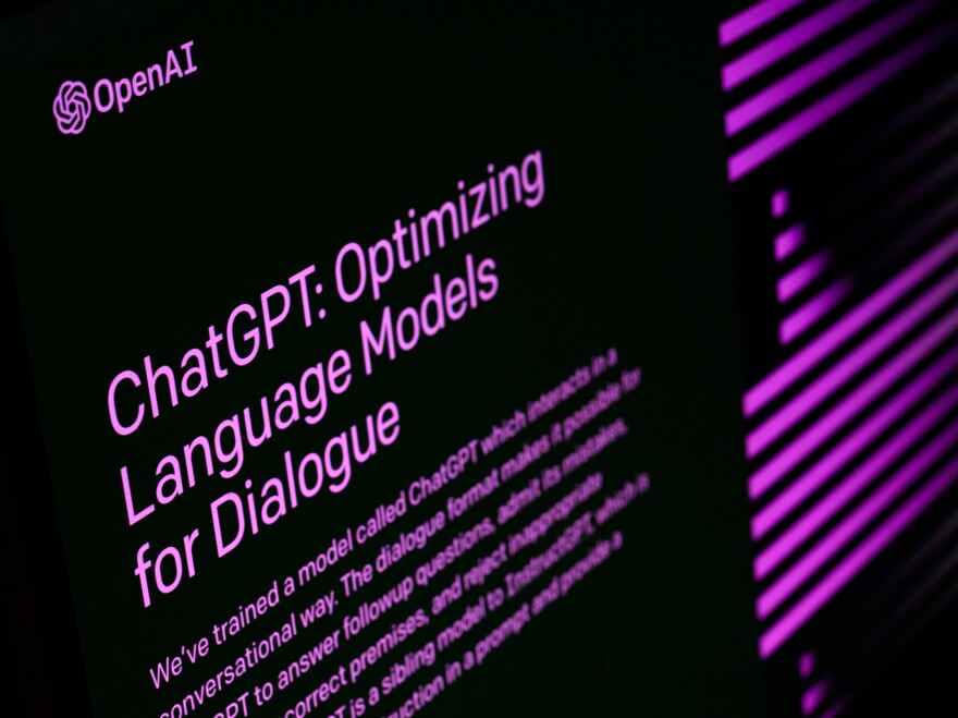 A screen with a black background and purple writing says "ChatGPT: Optimizing Language Models for Dialogue"
