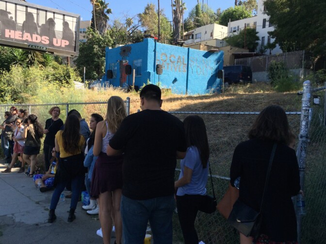 Local Natives getting ready to perform on top of its practice space in Silver Lake.
