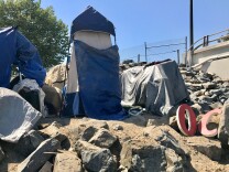 A homeless encampment near the Santa Ana River, April 21, 2017. According to a January 2019 tally, 6,860 people sleep outside or in shelters in Orange County.  
