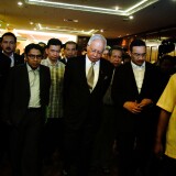 Prime Minister of Malaysia (C), Najib Razak leaves after an ad hoc press conference on March 24, 2014 in Kuala Lumpur, Malaysia. Prime Minister Najib Razak spoke at the press conference to announce that fresh analysis of available satellite data has concluded that missing flight MH370's final position was in the southern Indian Ocean. French authorities reported a satellite sighting of objects in an area of the southern Indian Ocean where China and Australia have also reported similar sightings of potential debris from the flight that went missing on March 8. 