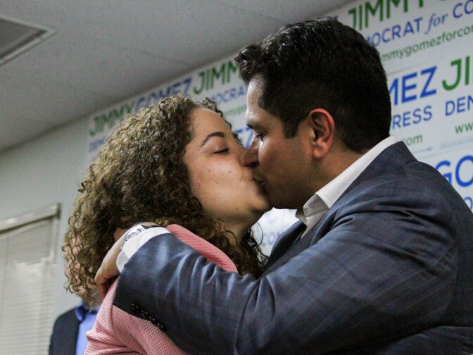 A victorius Jimmy Gomez celebrates with his partnerd Mary Hodge at the campaign headquarters on June 6, 2017, in the Eagle Rock community of Los Angeles, California.