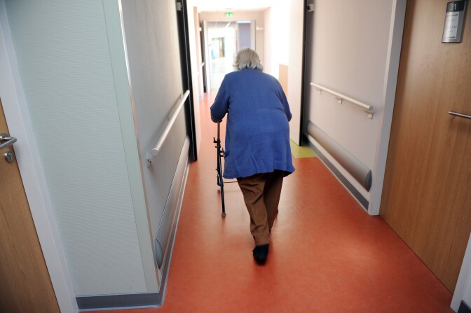 An elderly woman walks with a walker on December 29, 2011 at an old people's home near Montauban, south western France. AFP PHOTO / ERIC CABANIS (Photo credit should read ERIC CABANIS/AFP/Getty Images)