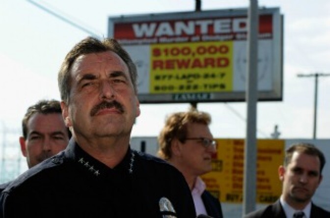Los Angeles Police Department police chief Charlie Beck standing in front of one of 300 billboards showing a wanted poster for two suspects then wanted for the beating of a San Francisco Giants fan Bryan Stow. 