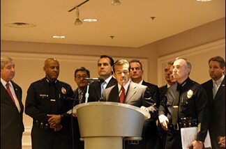 The conference called for no cuts and an increase in LAPD cops on the street. (L-R) D.A. Steve Cooley (red tie); embattled City Atty. Rocky Delgadillo (looking stoic); the Mayor; Councilman Jack Weiss (with devil eyes), who wants Delgadillo's job; Chief Bill Bratton (with badge).