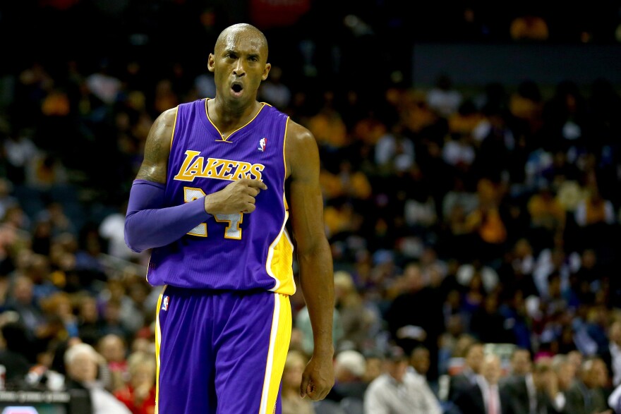 CHARLOTTE, NC - DECEMBER 14:  Kobe Bryant #24 of the Los Angeles Lakers reacts after a call during their game against the Charlotte Bobcats at Time Warner Cable Arena on December 14, 2013 in Charlotte, North Carolina.  NOTE TO USER: User expressly acknowledges and agrees that, by downloading and or using this photograph, User is consenting to the terms and conditions of the Getty Images License Agreement.  (Photo by Streeter Lecka/Getty Images)