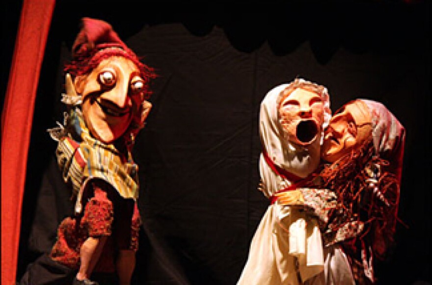 One of theatre's most hilarious and disturbing families: Punch, Judy, and their baby.