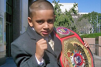Mighty Mo puts up his dukes with his championship belt.