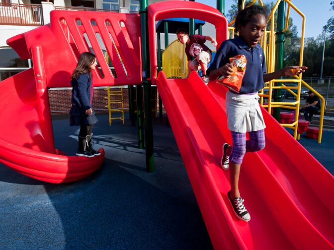 Marguerita Elementary School students in Alhambra enjoy a new playground after school on Friday, Dec. 7. The playground was funded by a capital appreciation bond that is expected to be paid off in 30 years.