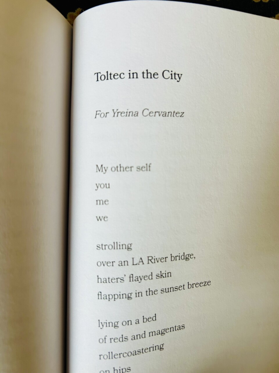 A book opened to a page with a poem.