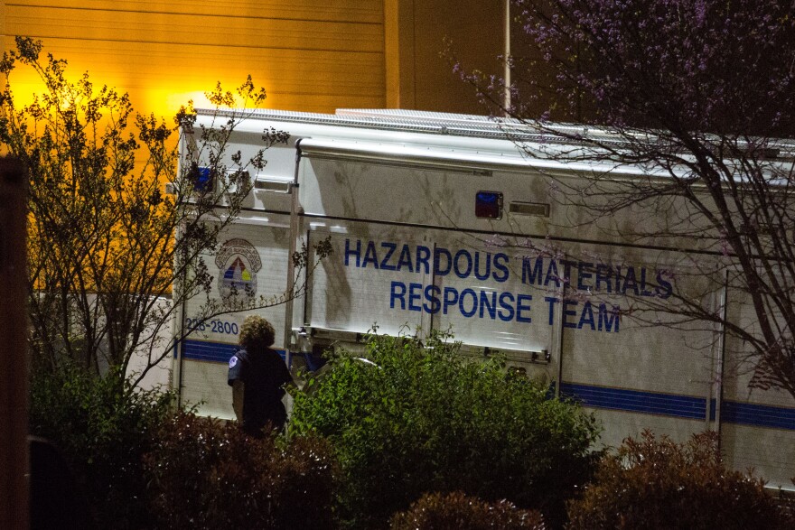An official walks past a hazardous materials response team truck outside a mail sorting facility on April 16, 2013 in Hyattsville, Maryland. An envelope addressed to U.S. Sen. Roger Wicker (R-MS) tested positive for ricin at the facility where mail bound for the U.S. Capitol is sorted.