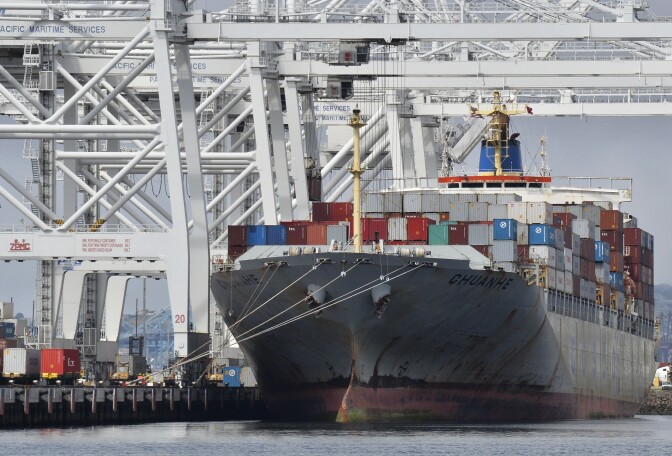 A cargo ship stands on Long Beach harbour, California. If the SCIG rail yard project is approved, cargo will be transferred onto freight trains closer to the port.