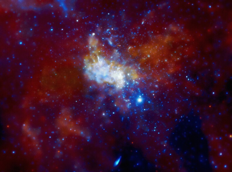 This image from NASA's Chandra X-ray Observatory shows the center of our Galaxy, with a supermassive black hole known as Sagittarius A* (Sgr A* for short) in the center. Using intermittent observations over several years, Chandra has detected X-ray flares about once a day from Sgr A*. The flares have also been seen in infrared data from ESO's Very Large Telescope in Chile.
 
A new study provides a possible explanation for the mysterious flares. The suggestion is that there is a cloud around Sgr A* containing hundreds of trillions of asteroids and comets , which have been stripped from their parent stars. The panel on the left is an image containing nearly a million seconds of Chandra observing of the region around the black hole, with red representing low-energy X-rays, green as medium-energy X-rays, and blue being the highest.
 
An asteroid that undergoes a close encounter with another object, such as a star or planet, can be thrown into an orbit headed towards Sgr A*, as seen in a series of artist's illustrations beginning with the top-right panel. If the asteroid passes within about 100 million miles of the black hole, roughly the distance between the Earth and the Sun, it would be torn into pieces by the tidal forces from the black hole (middle-right panel).
 
These fragments would then be vaporized by friction as they pass through the hot, thin gas flowing onto Sgr A*, similar to a meteor heating up and glowing as it falls through Earth's atmosphere. A flare is produced (bottom-right panel) and eventually the remains of the asteroid are swallowed by the black hole.
 
Another solar system analogy for this type of event has recently been reported. About once every three days a comet is destroyed when it flies into the hot atmosphere of the Sun. So, despite the significant differences in the two environments, the destruction rate of comets and asteroids by the Sun and Sgr A* may be similar.
 
Very long observations of Sgr A* will be made with Chandra later in 2012 that will give valuable new information about the frequency and brightness of flares and should help to test the model proposed here to explain them. This work has the potential to understand the ability of asteroids and planets to form in the harsh environment of Sgr A*.
 
Credit: X-ray: NASA/CXC/MIT/F. Baganoff et al.; Illustrations: NASA/CXC/M.Weiss
 
Read entire caption/view more images: www.chandra.harvard.edu/photo/2012/sgra/index.html
 
Caption credit: Harvard-Smithsonian Center for Astrophysics
