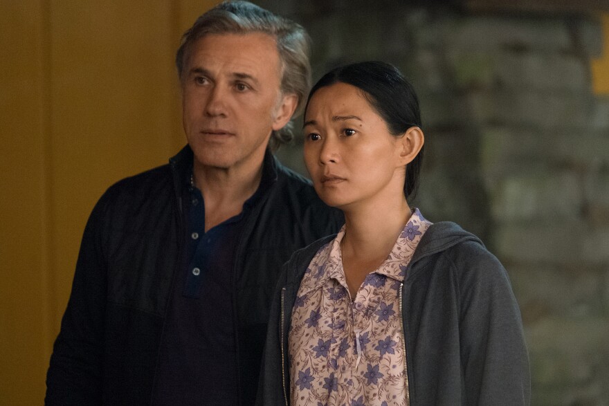 Hong Chau plays Ngoc Lan Tran and Christoph Waltz plays Dusan Mirkovic in Downsizing from Paramount Pictures.