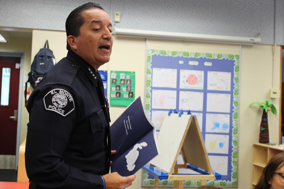 El Monte Police Chief David Reynoso reading to preschoolers at the Jeff Seymour Family Center in El Monte September 25, 2017.
