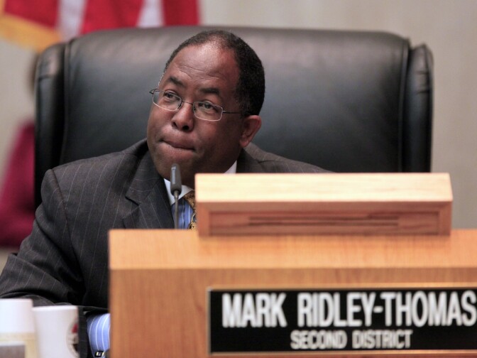 Los Angeles County Supervisor Mark Ridley-Thomas casts the deciding vote for the Board of Supervisors 3-2 vote to join the city in its economic boycott of Arizona over its SB 1070 law targeting illegal immigrants, on Tuesday, Jun 1, 2010, in Los Angeles. The SB 1070 law takes effect July 29 unless blocked by a court as requested under pending legal challenges.