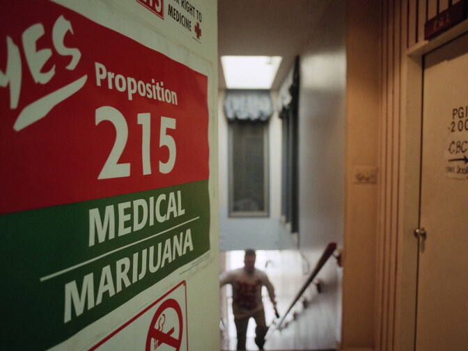 A staff member of the Cannabis Buyers Club walks up the stairs to the club in the Hollywood section of Los Angeles on election eve on Tuesday, Nov. 5, 1995 in Los Angeles. One of the propositions voters in California will decide on is whether to legalize marijuana for medical purposes. The Cannabis Buyers Club sells marijuana to patients who can prove, with a doctors prescription, that they need the product for certain medical reasons. 