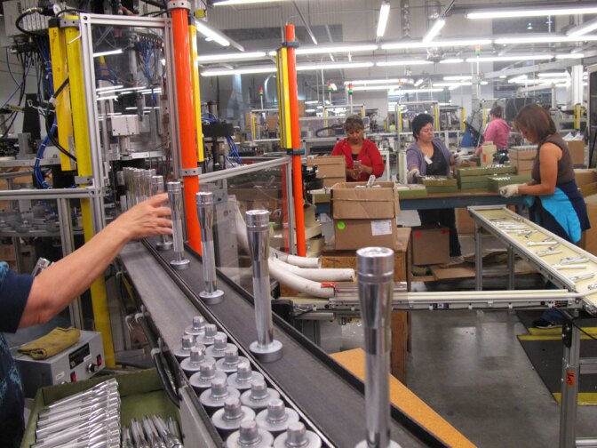 Workers assemble Maglites in the company's U.S. factory. The process is largely automated now and much of the production is done in-house.