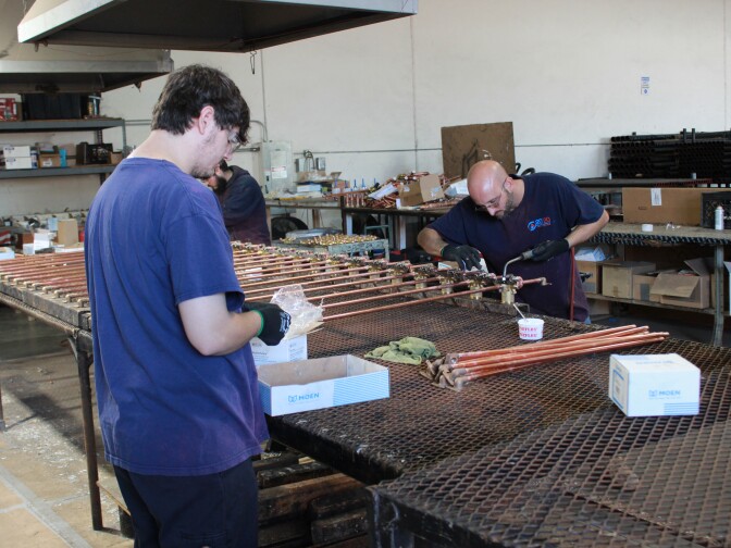 Workers at 20/20 prepare plumbing and HVAC systems for installation into newly constructed homes and apartment buildings, Oct. 16, 2019.