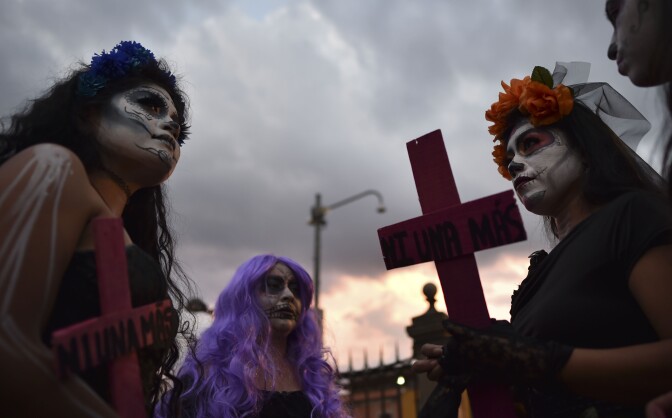 Women with crosses protest against femicides in Mexico City on November 1, 2016.