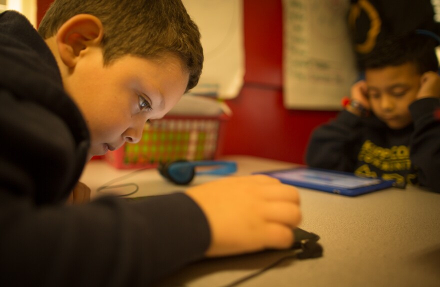 Second graders Mark G. and Brandon C. play educational games on iPads at a charter school in Huntington Park.