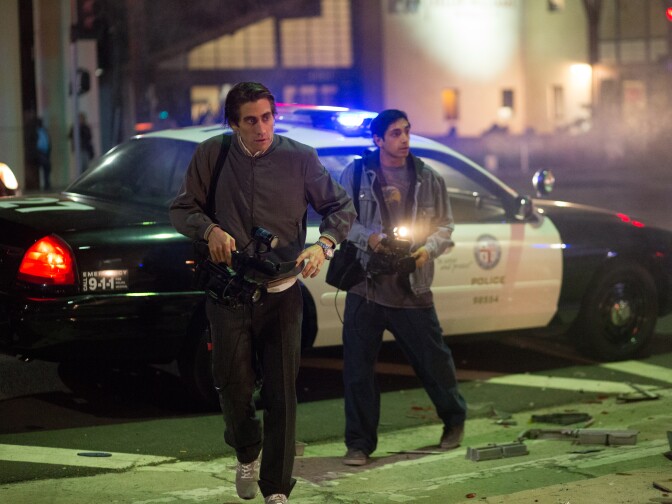 Jake Gyllenhaal as Lou Bloom and Riz Ahmed as Rick in "Nightcrawler," written and directed by Dan Gilroy, opening October 31, 2014.