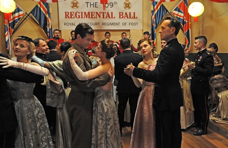 Callum Turner (Bill Rohan) dancing with Aimee-Ffion Edwards (Sophie Adams) and Miriam Rizea (Peggy) dancing with Richard E. Grant (Major Cross) - ©Sophie Mutevelian