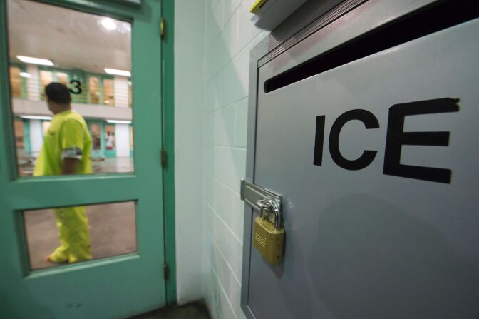 An immigration detainee stands near an US Immigration and Customs Enforcement (ICE) grievance box in the high security unit at the Theo Lacy Facility, a county jail which also houses immigration detainees arrested by the US Immigration and Customs Enforcement  (ICE), March 14, 2017 in Orange, California, about 32 miles (52km) southeast of Los Angeles. 
US President Donald Trumps first budget provides more than USD 4.5 billion in new spending to fight illegal immigration by adding immigration and border enforcement agents, prosecutors and judges, as well as building a wall on the border with Mexico. / AFP PHOTO / Robyn Beck        (Photo credit should read ROBYN BECK/AFP/Getty Images)