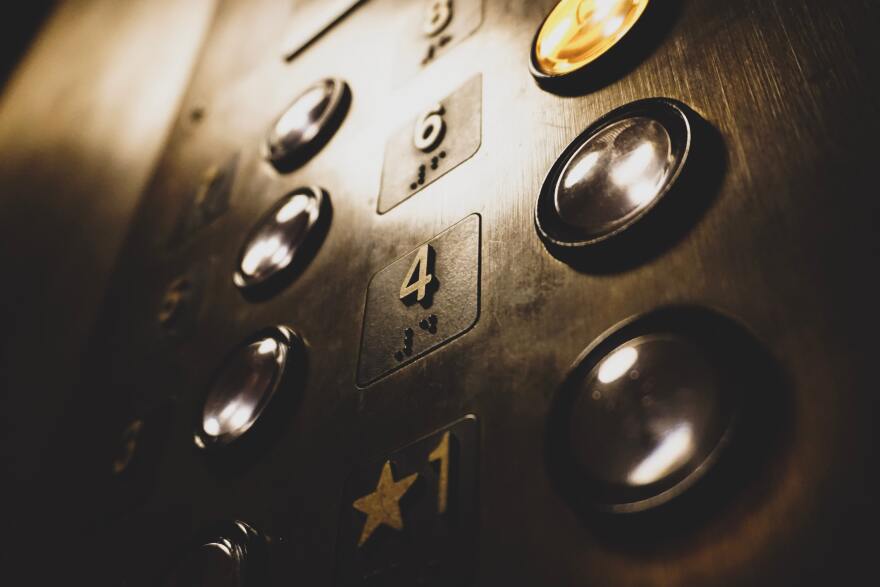 A low angle showing buttons in an elevator.