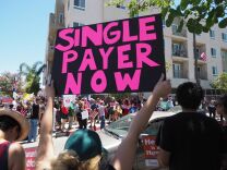 People rally in favor of single-payer healthcare for all Californians as the US Senate prepares to vote on the Senate GOP health care bill, outside the office of California Assembly Speaker Anthony Rendon, June 27, 2017 in South Gate, California.  
Rendon announced last week that Senate Bill SB 562 - the high-profile effort to establish a single-payer healthcare system in California - would be shelved, saying it was "incomplete."    / AFP PHOTO / Robyn Beck        (Photo credit should read ROBYN BECK/AFP/Getty Images)